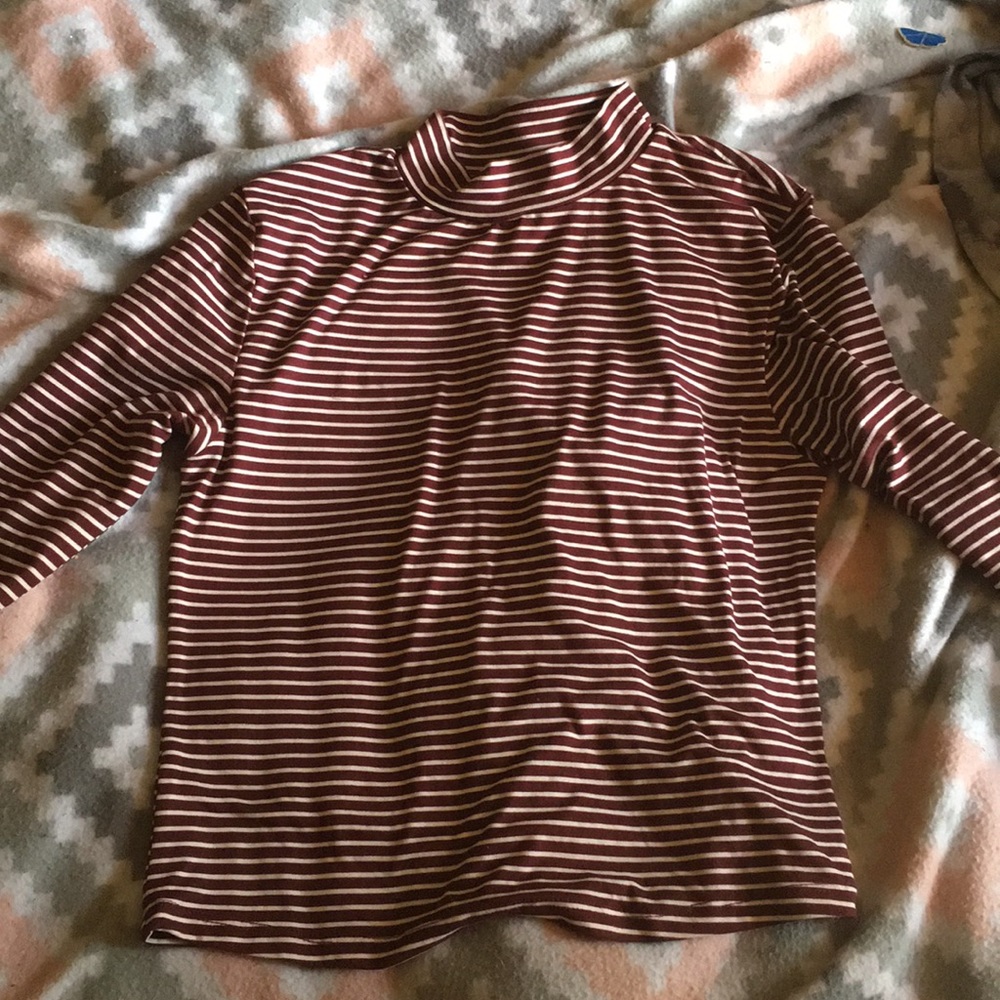 maroon and white striped turtle neck .